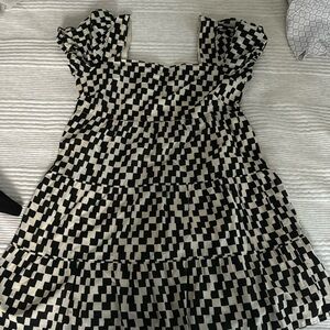 Checkered baby doll mini dress with subtle puffed sleeves and a square neck!